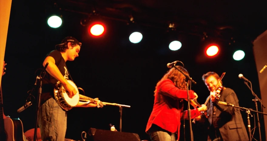 a man and woman playing instruments at an event