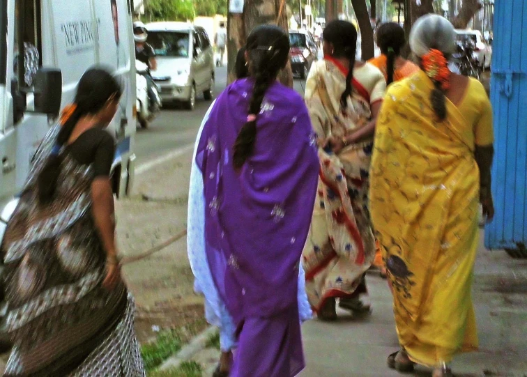 a group of people walking down a street