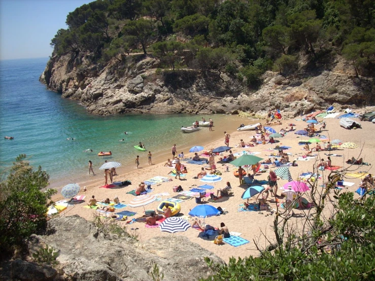 there are many people relaxing on the beach