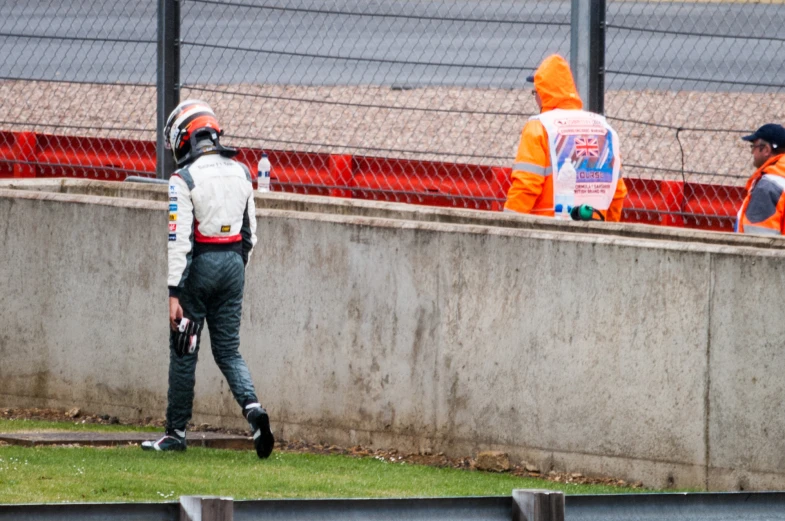 the two men are working on the track and ready to start