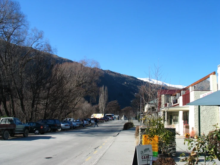 cars parked in front of houses on the street