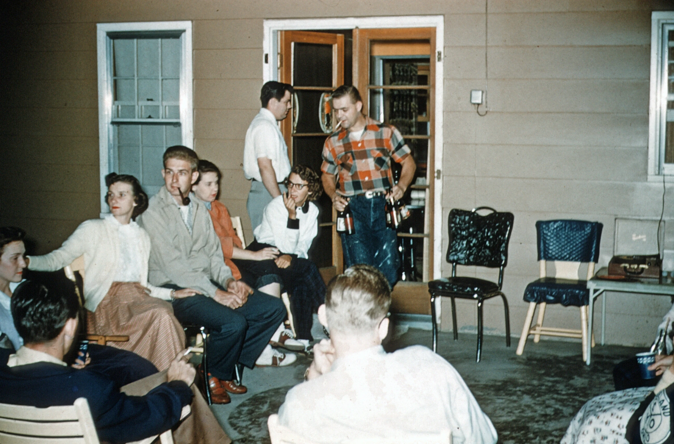 a group of people sitting in front of a building