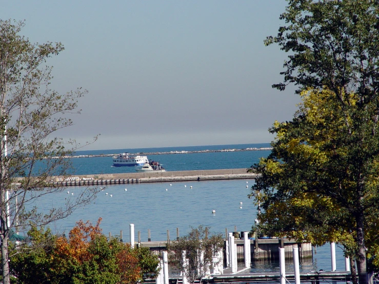 view of an ocean and dock from across the bay