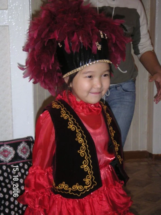a  is dressed in costume and smiles for the camera