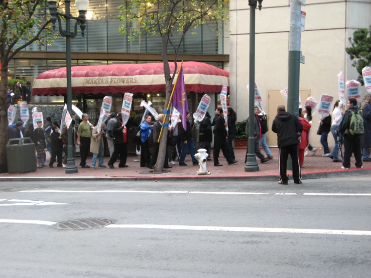 several people on a city street protesting