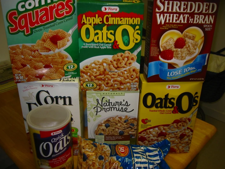 some cereal and cereal products sitting on a table