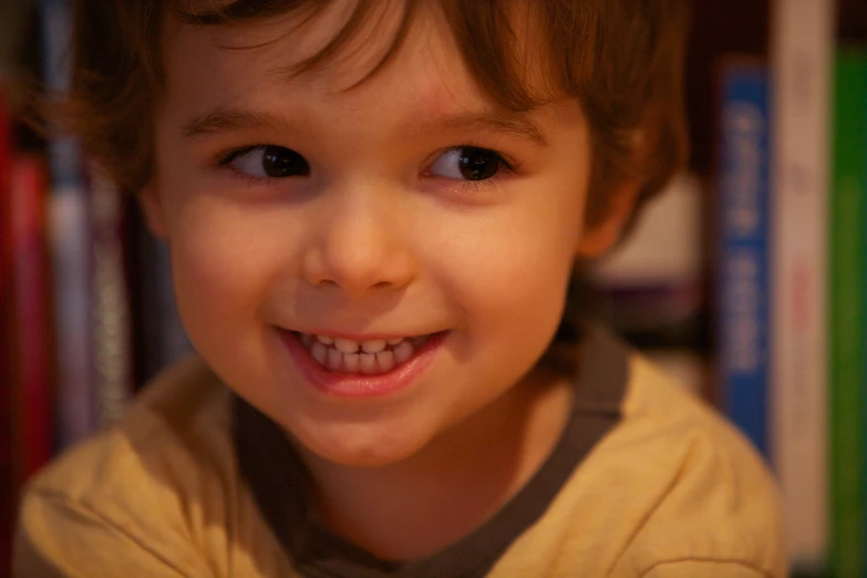 a  smiling with ces on his teeth