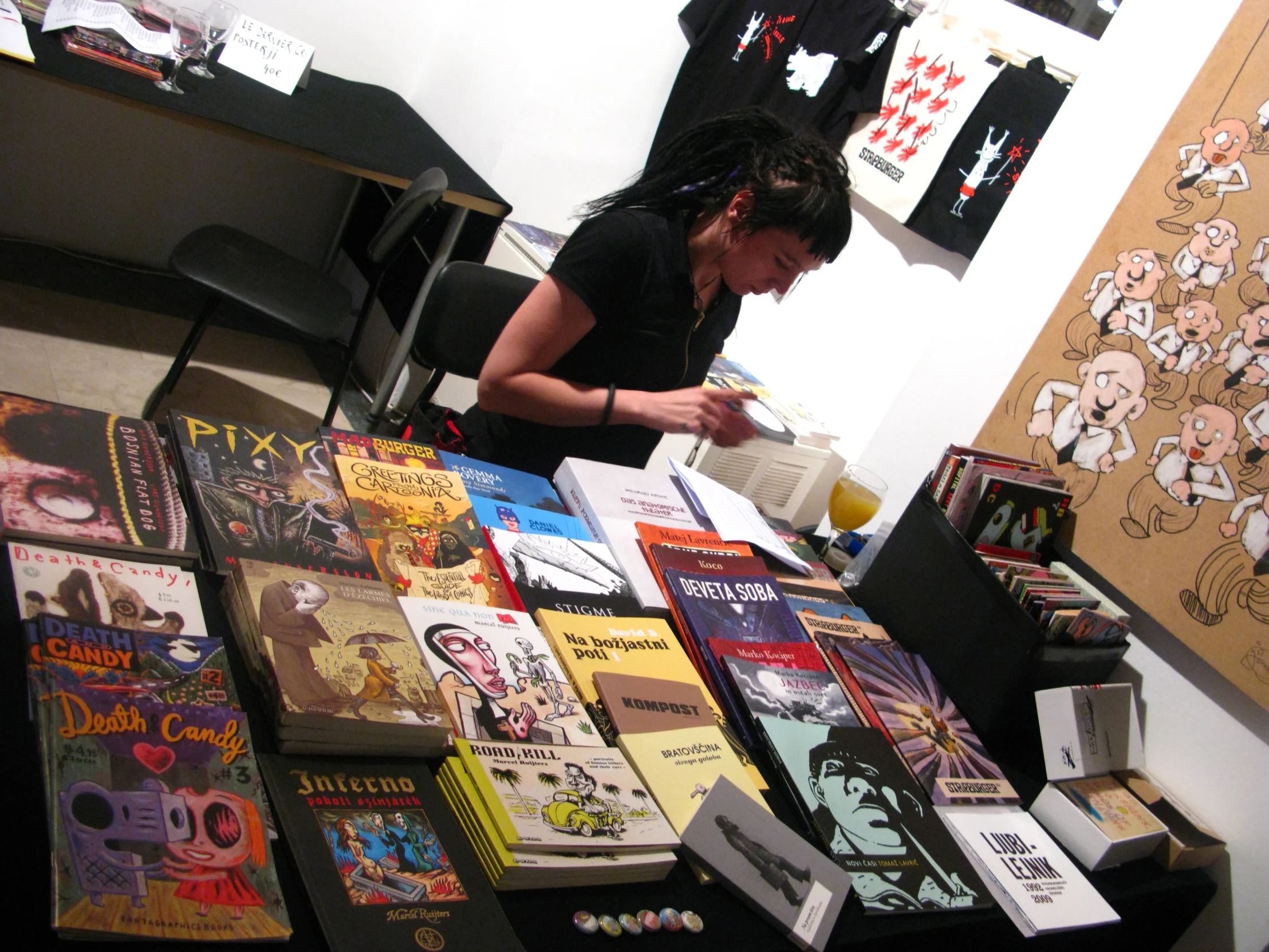 a woman looking at comics in a bookstore