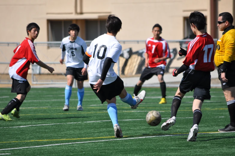 people playing a game of soccer on a field