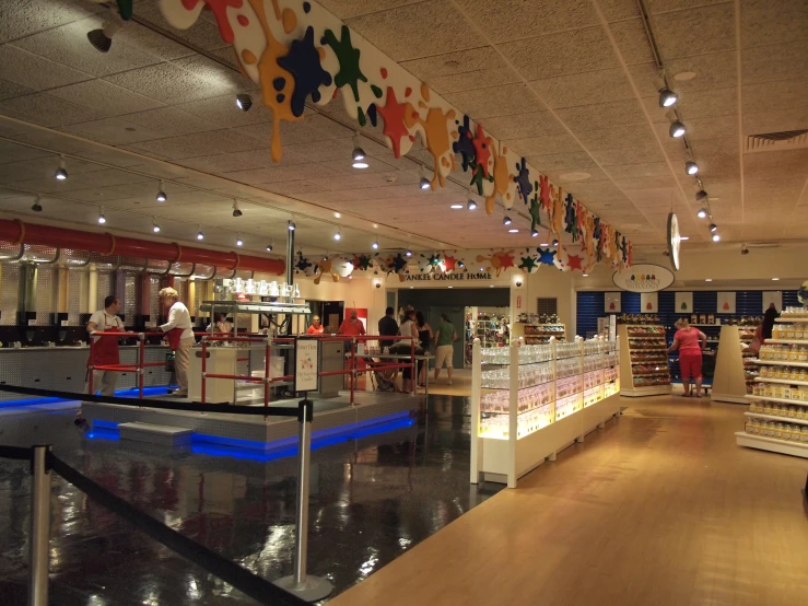 a shop in a mall with people at the counter