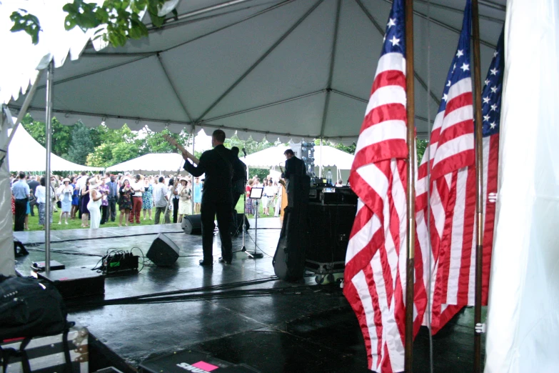 a concert stage that is under a tent