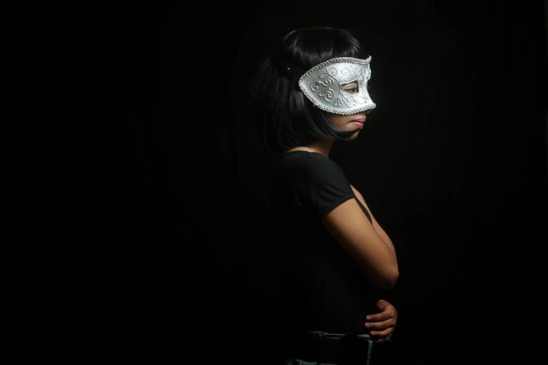 a person wearing an elaborate white mask