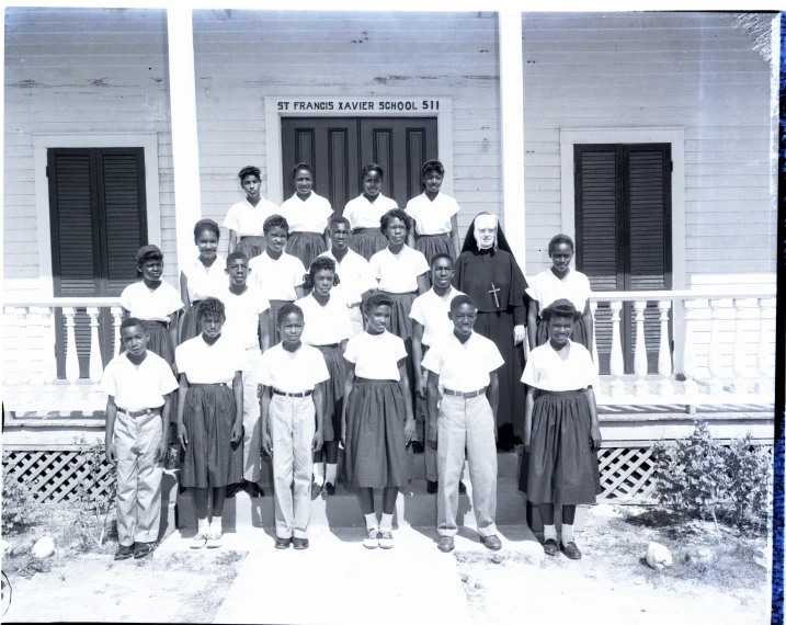 a black and white po of a group of people outside a building