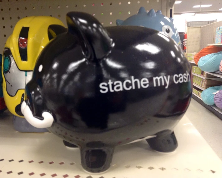 a large black piggy bank with a large white dog on it