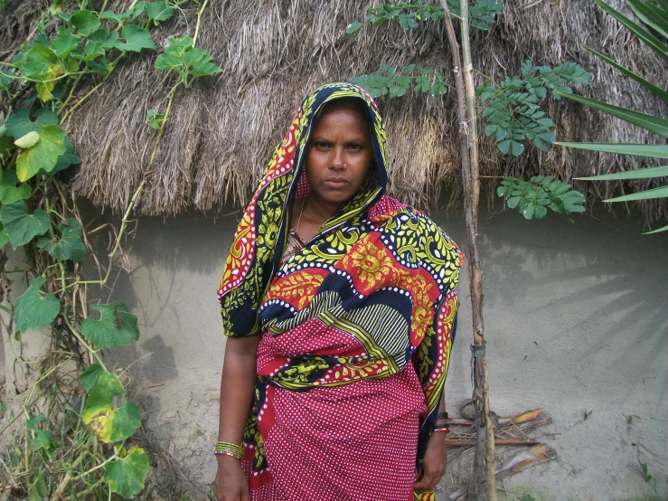 a woman is in a native style shawl