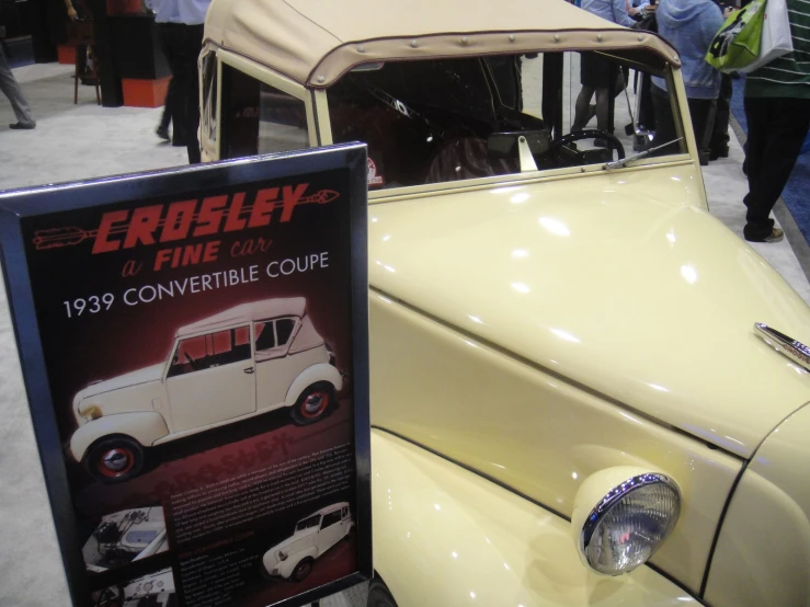 a classic car sitting on display during an auto show