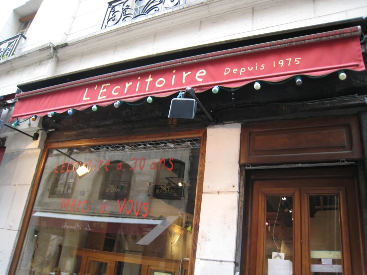 the shopfront of a french department store is open