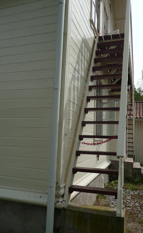 a wooden staircase leading to the top of a house