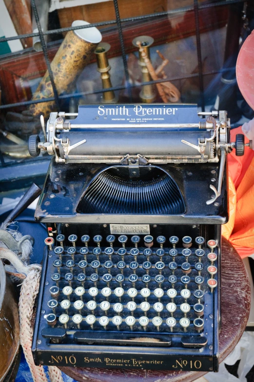 a black old fashioned typewriter with its case open