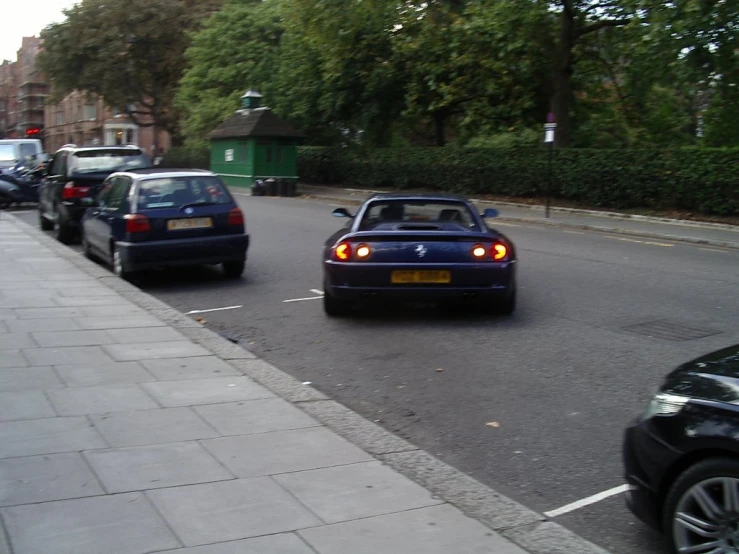 two cars are parked in front of the road