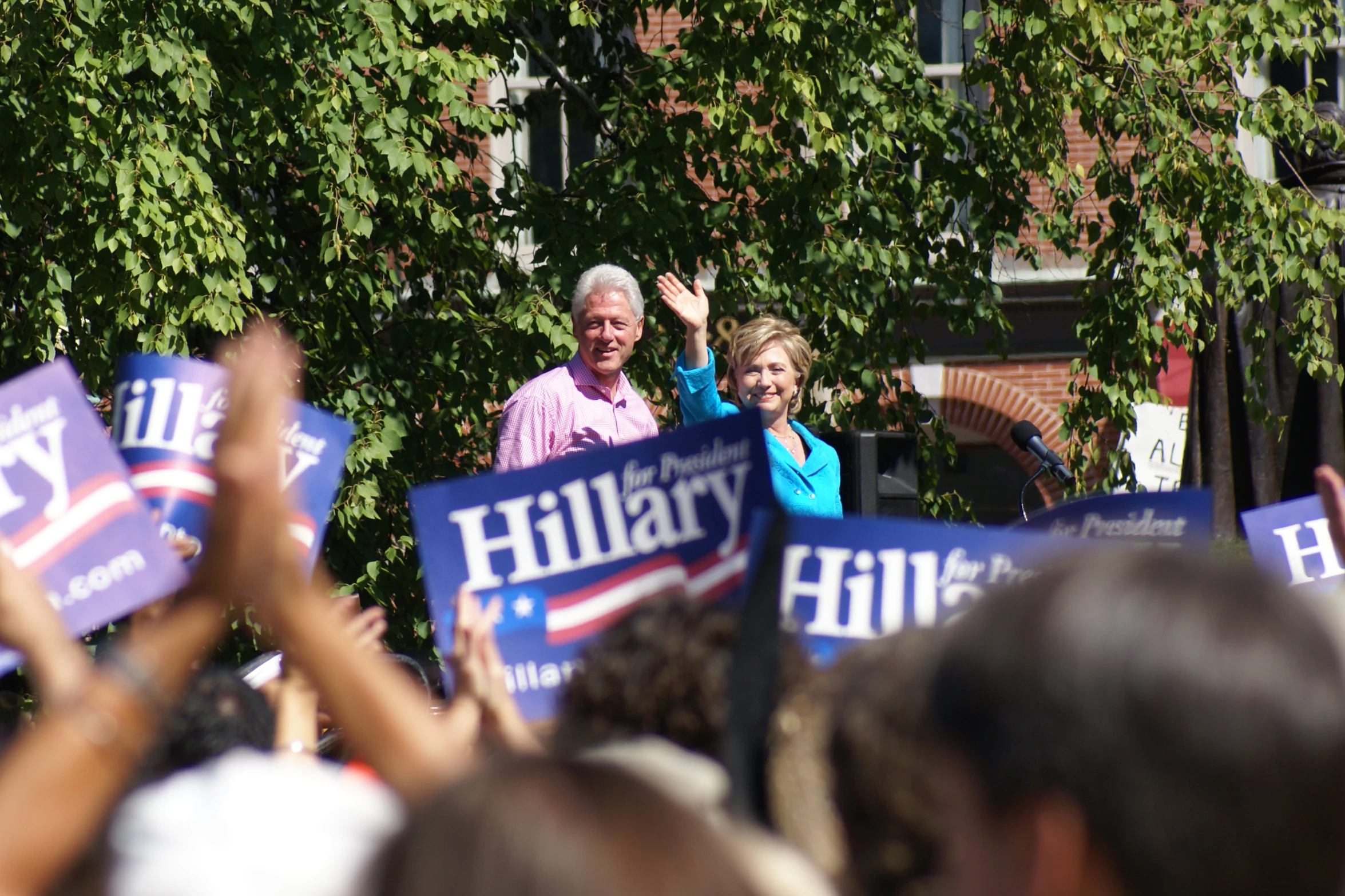 a couple of people that are holding signs