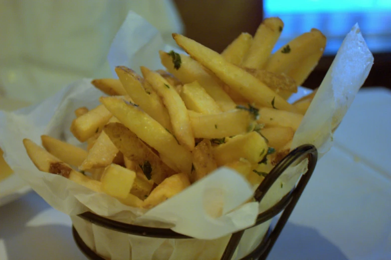 some type of basket filled with lots of fries