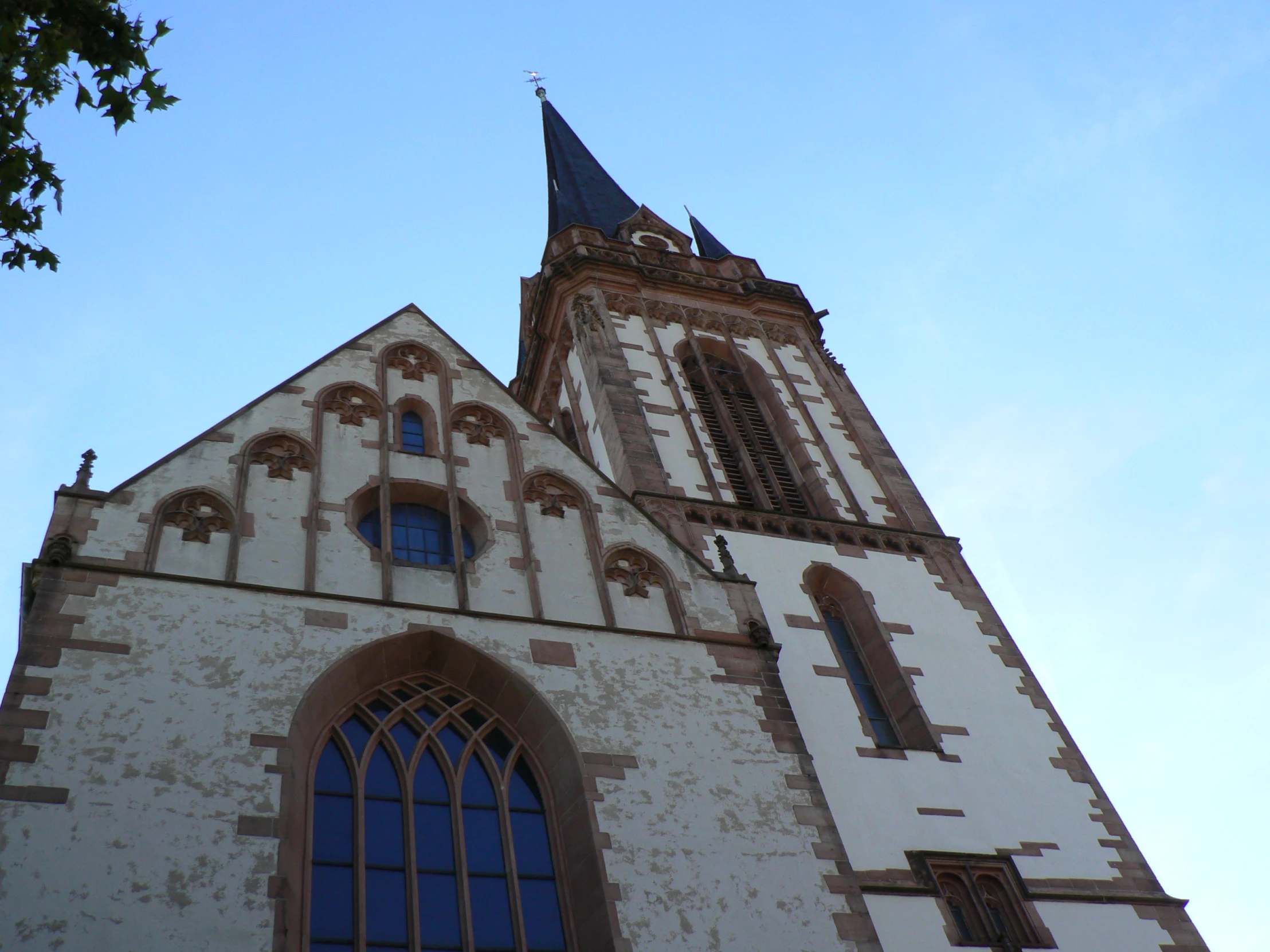 a church steeple with some windows on it