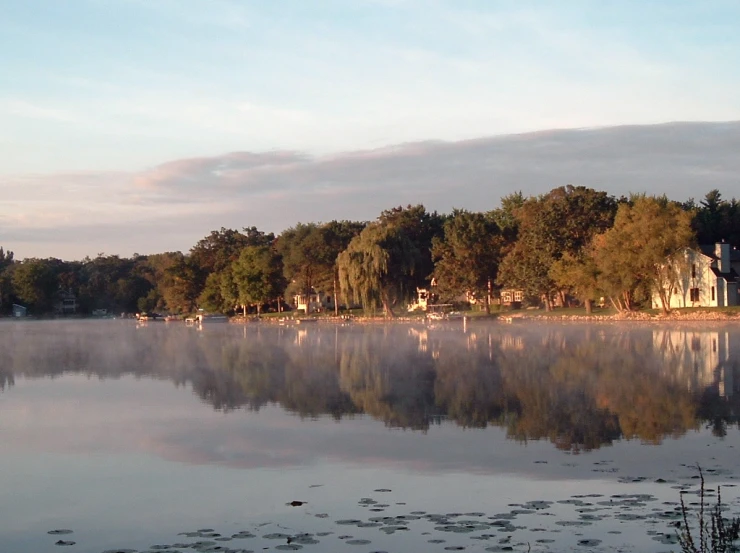 the lake looks peaceful and quiet on a beautiful day