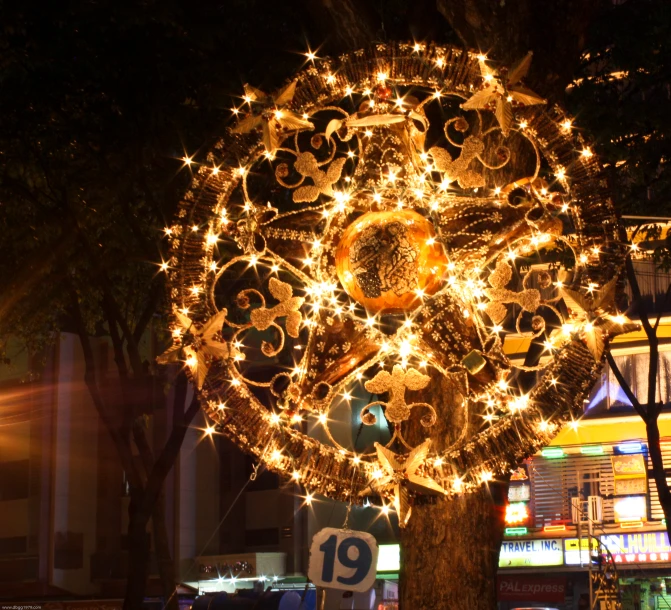 this tree is decorated with lights and numbers for a special occasion