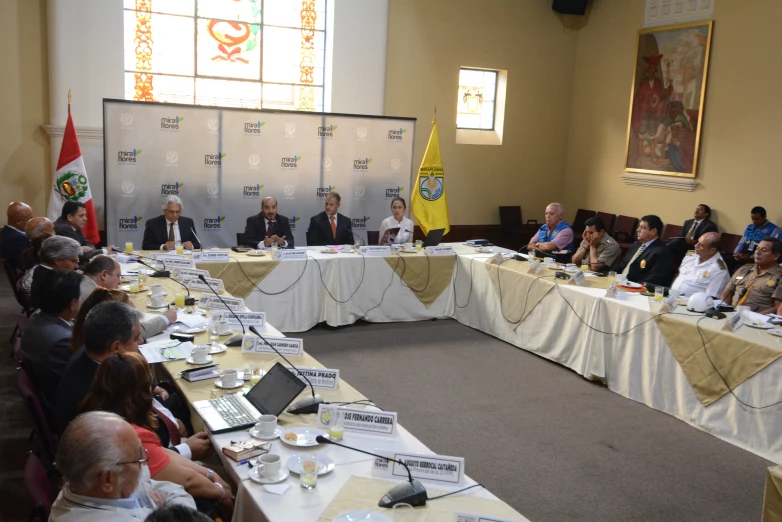 a group of people are sitting at a table together