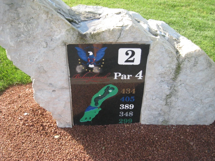 an award plaque for a person on a golf course