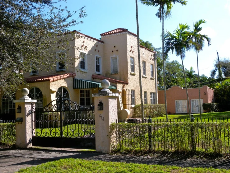 the gate is in front of a brick building