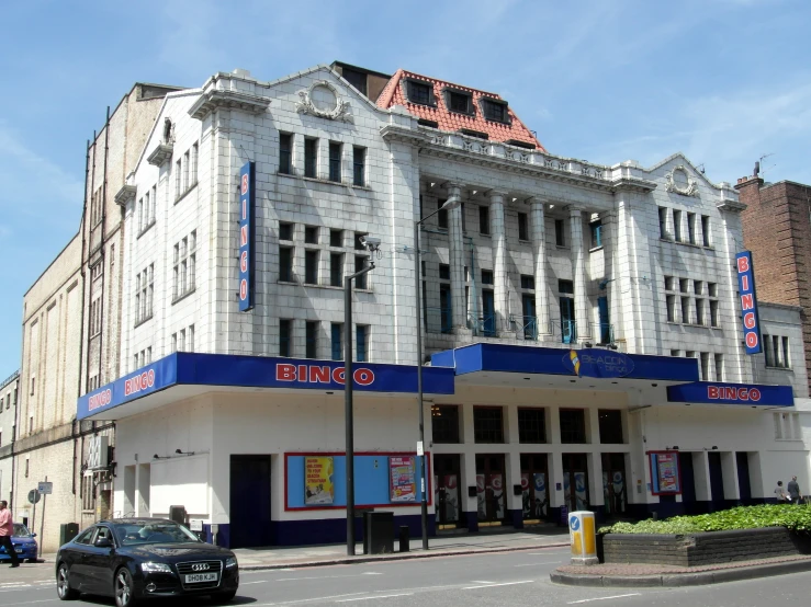 a large white building on the corner of a street