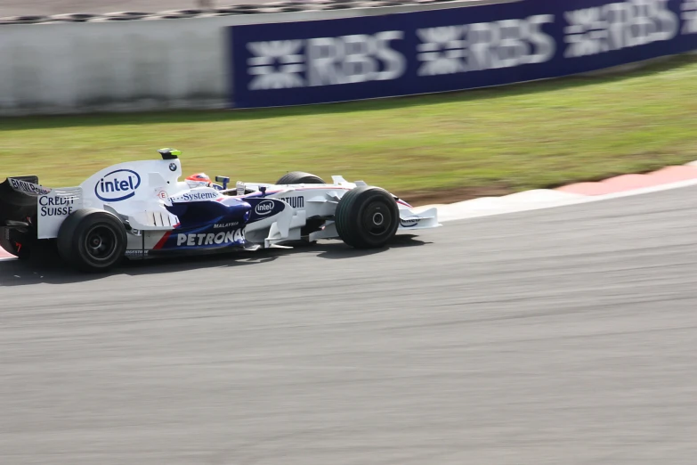 a racer going fast on the track during a race