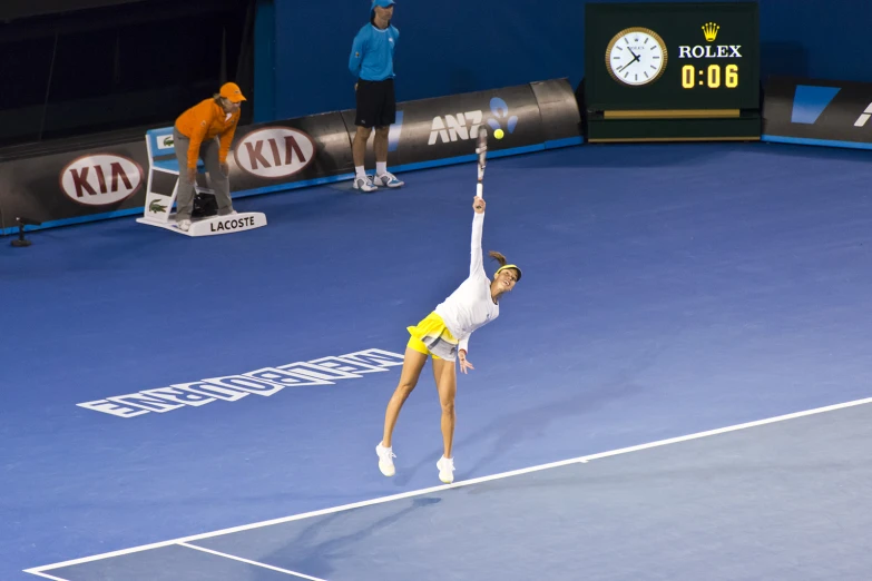 a person on a court with a tennis racket