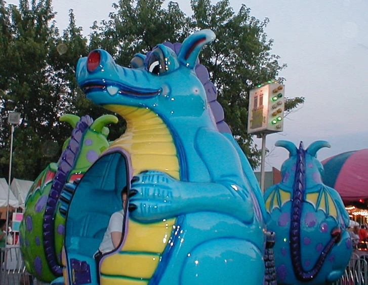 people are standing near a giant inflatable float