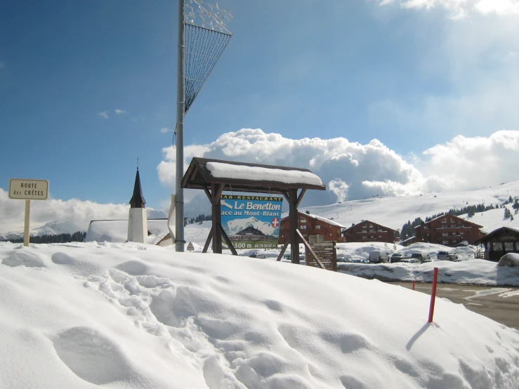 there is a sign with the words welcome in this snow - capped town