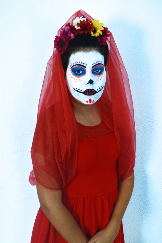 the young woman wears a colorful mask while posing for the camera