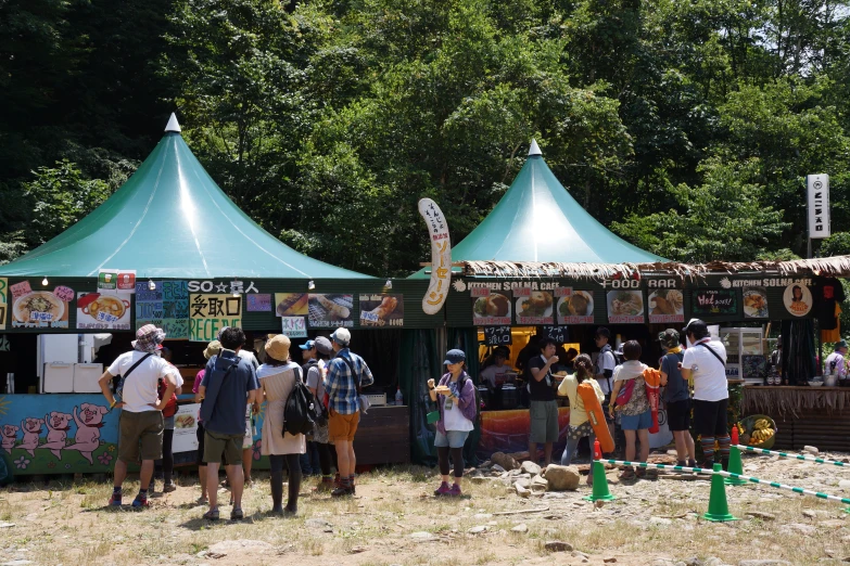 people stand in line at an amut exhibit