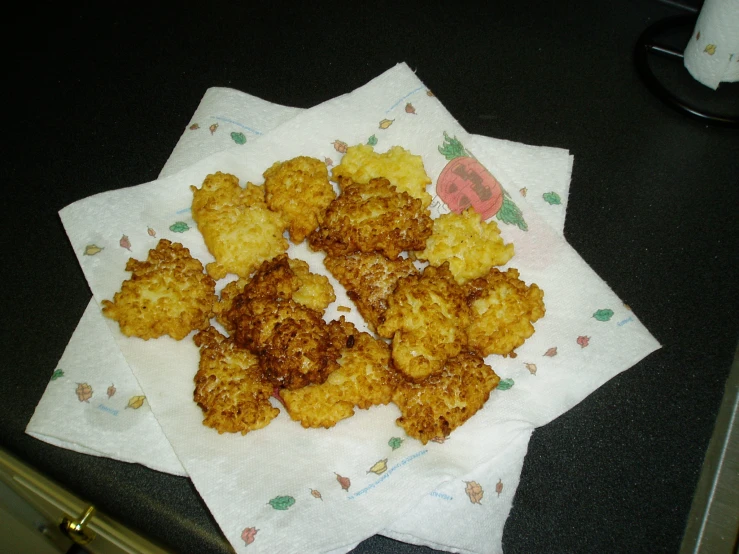 the fried food is placed on top of a napkin