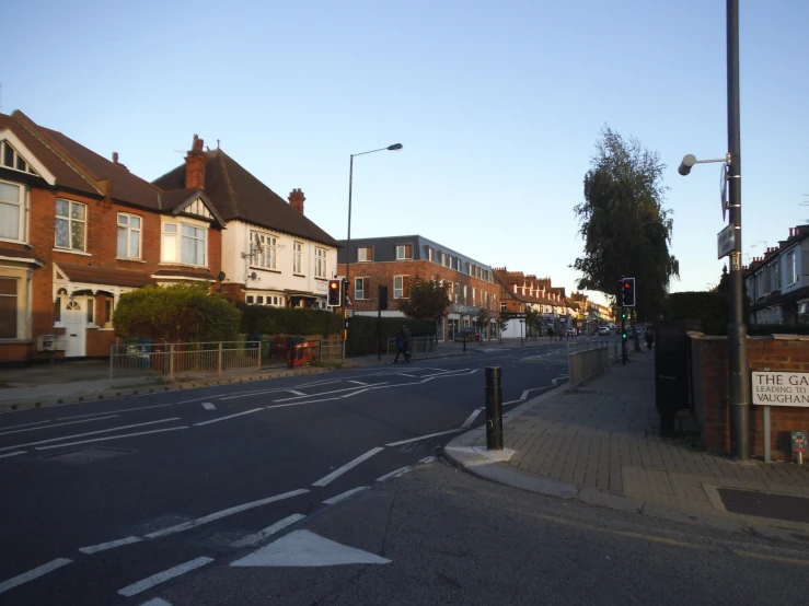 a city street with many different buildings along it