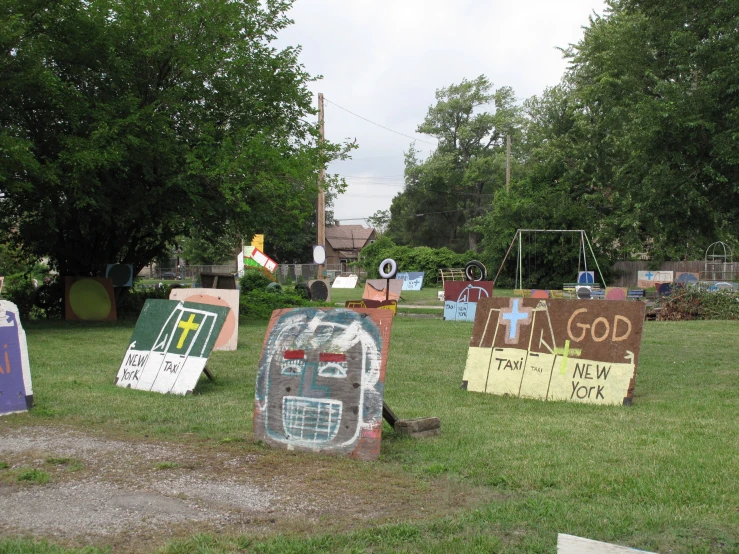 many signs lay on the ground to be used as decor