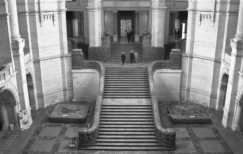 an interior view of an old building with steps in black and white