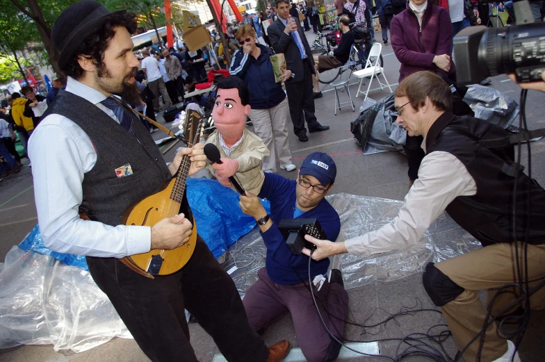 a group of people in a city with cameras on their laps