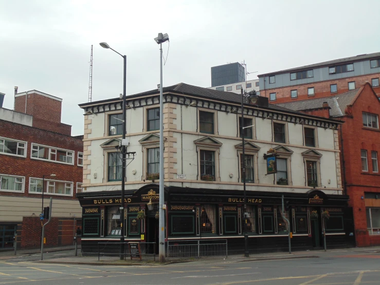 a picture of a street corner with old buildings