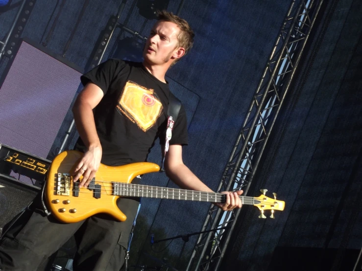 an electric guitar player is playing on stage