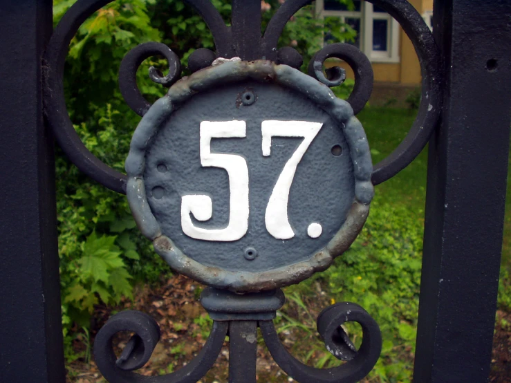 a close - up of a metal fence with the number seventy