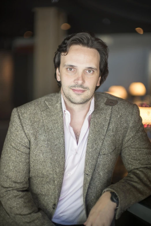 a man is sitting down at a table