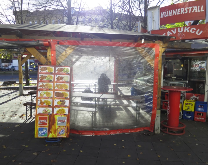 a picture of an outdoor booth that is selling food