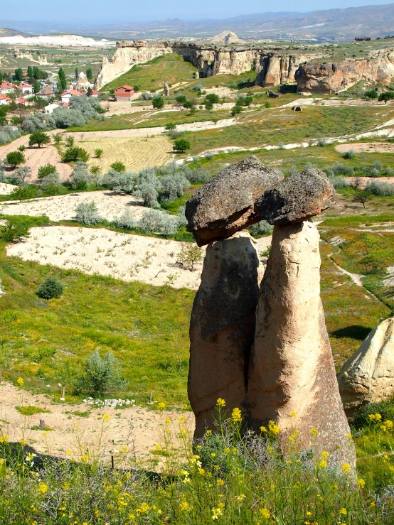 large boulders sitting next to each other on a hillside